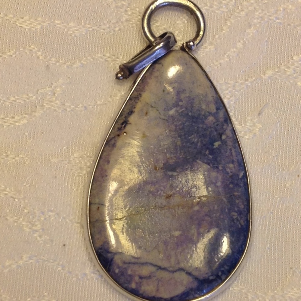 Sterling silver and blue stone pendant.